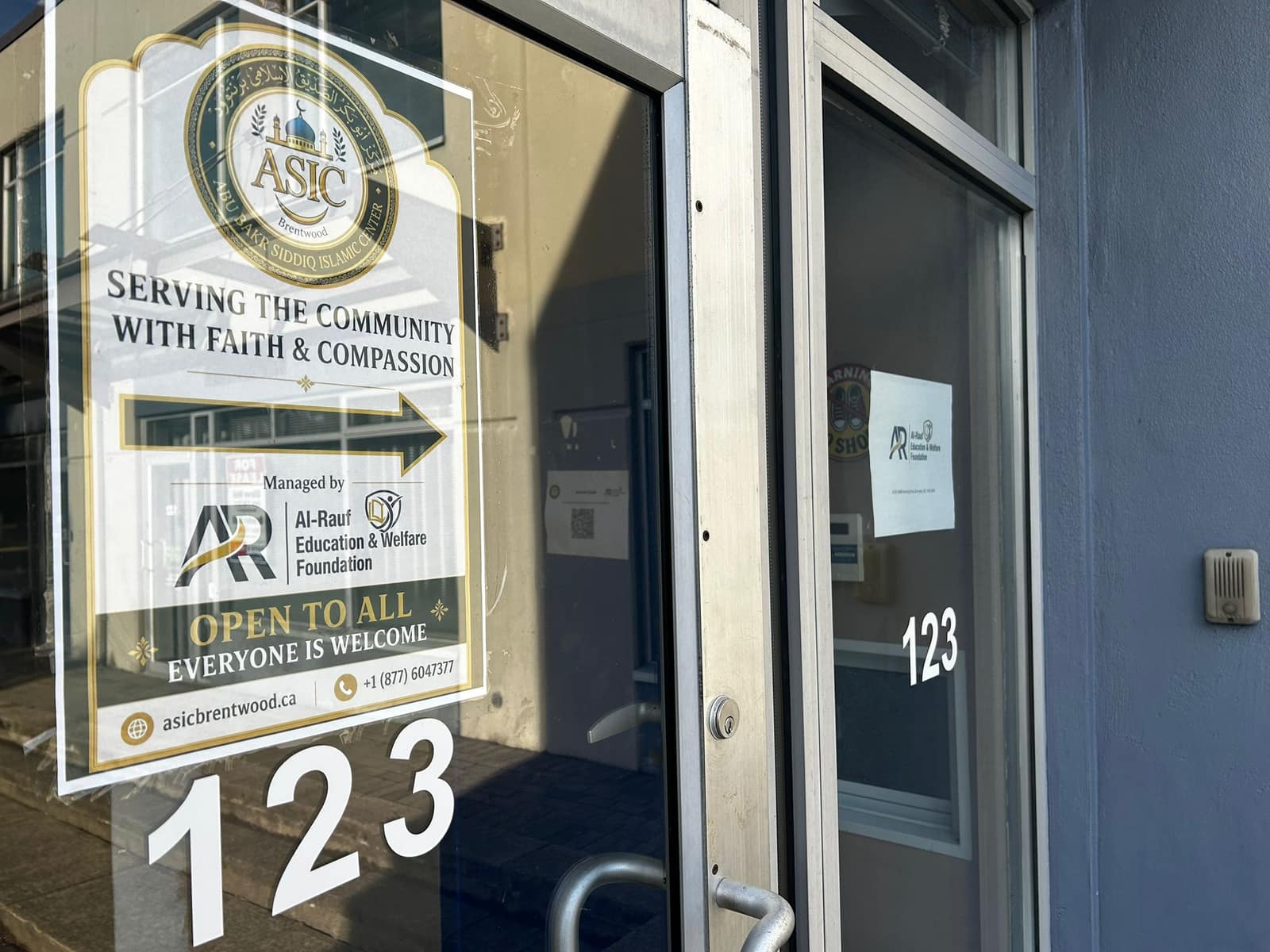 Center entrance signage at Unit 123