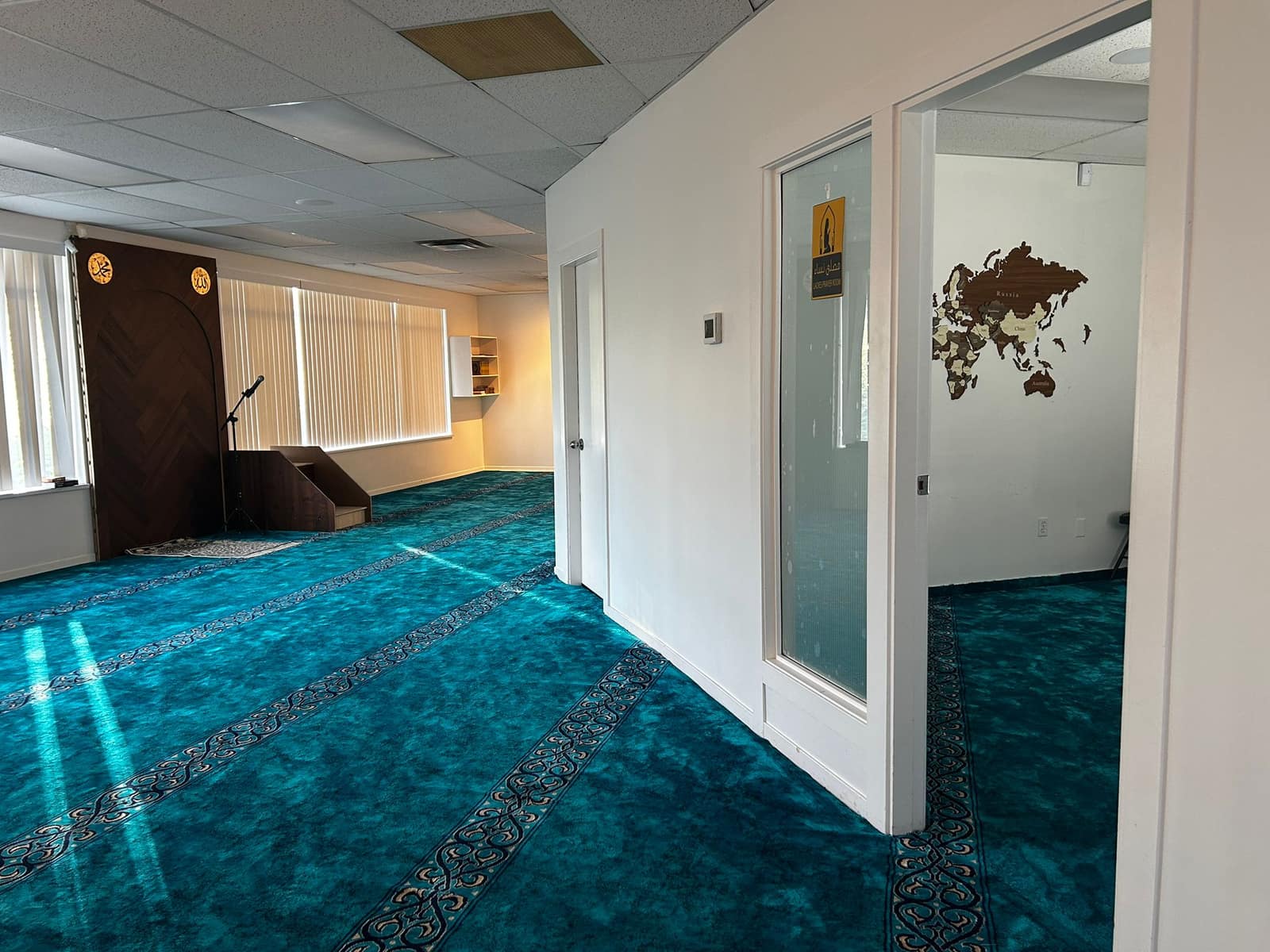 Hallway featuring Islamic calligraphy wall art