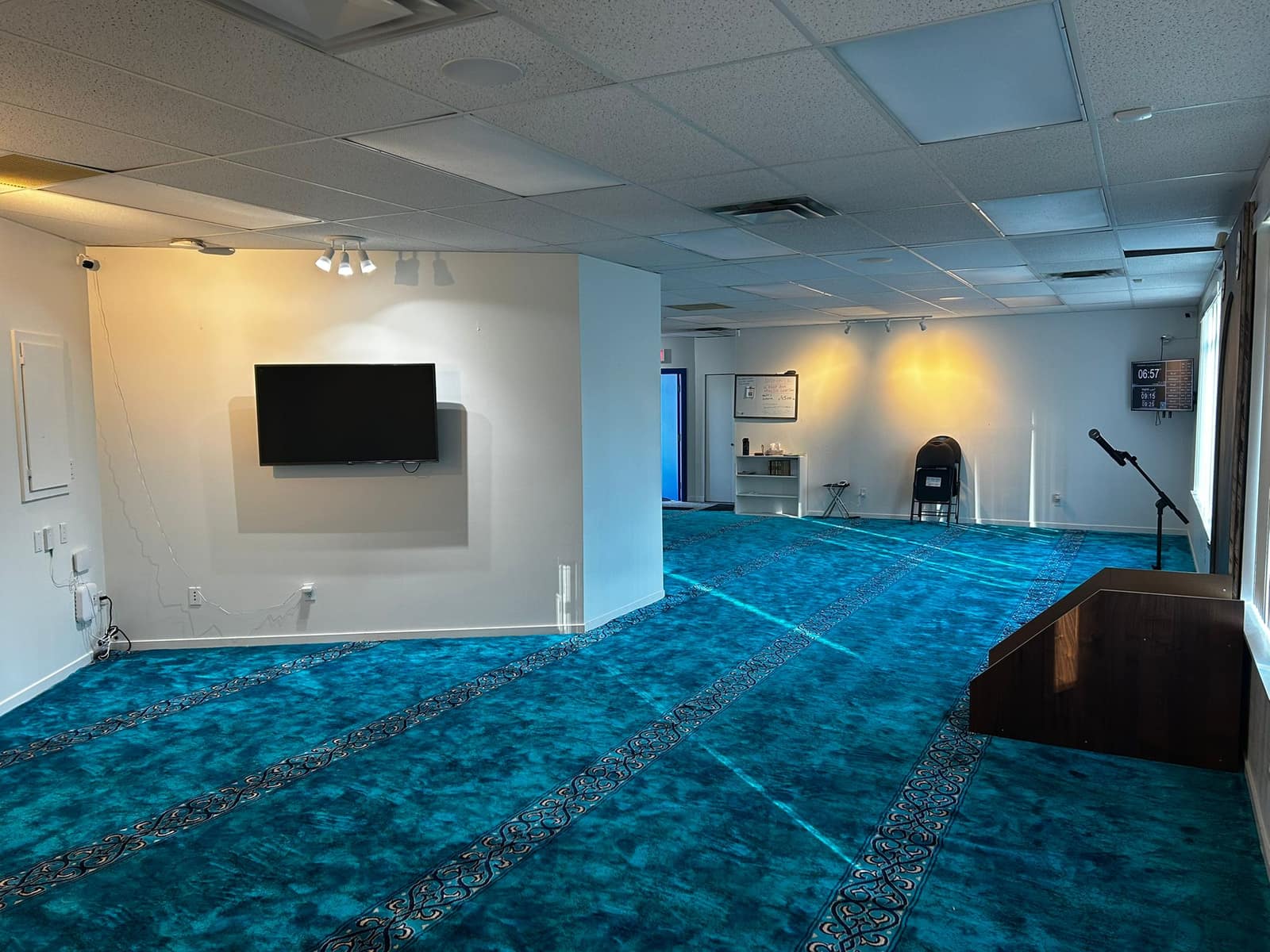 Prayer hall with a wall-mounted display screen
